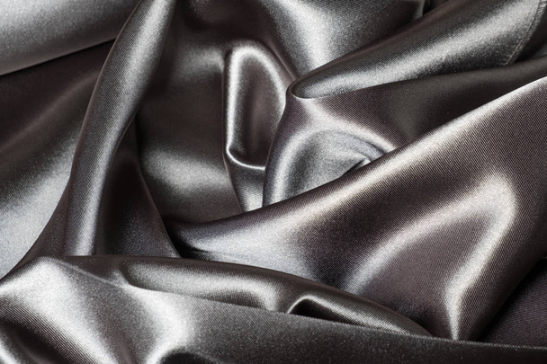 A full page close up of light brown silk material texture  - Φωτογραφία, εικόνα