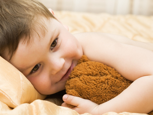 Cheerful kid with teddy bear - Photo, image