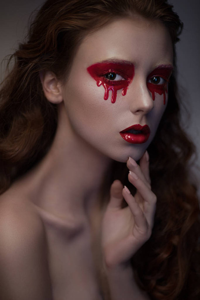 woman with bloody eyes - 写真・画像