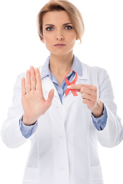 doctor with aids ribbon showing stop - Φωτογραφία, εικόνα