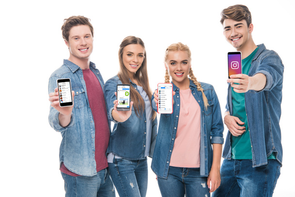 young friends holding smartphones  - Photo, Image