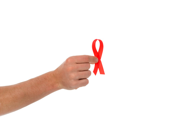 man holding aids ribbon - Foto, afbeelding
