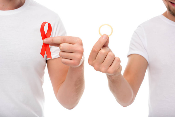 gay couple with aids ribbon and condom - Photo, Image