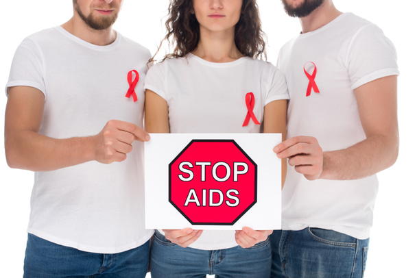 停止エイズ バナーを持つ人々 - 写真・画像