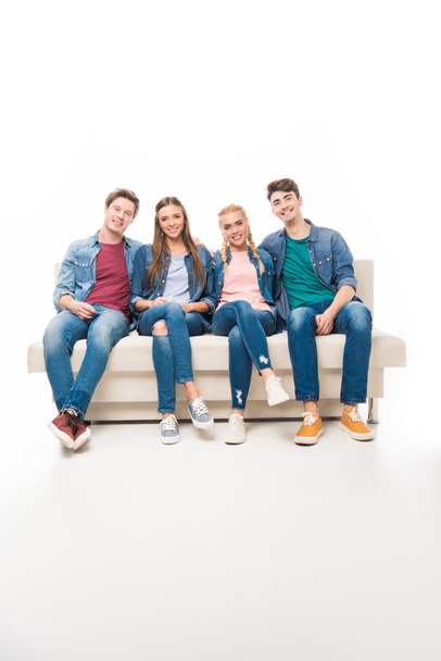 young friends sitting on sofa - Foto, immagini