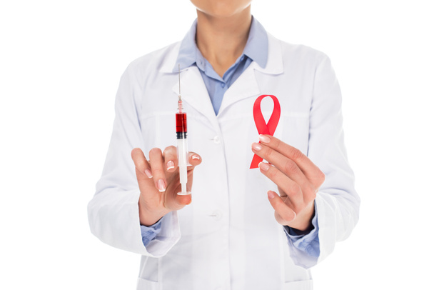 doctor with aids ribbon and syringe - Foto, Imagem
