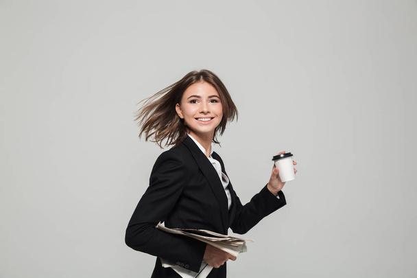 Portrait of a young attractive businesswoman in suit - Fotoğraf, Görsel
