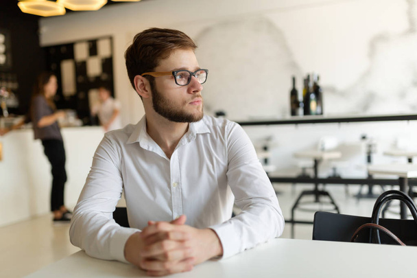 Businessman wearing shirt in cafe - Fotó, kép