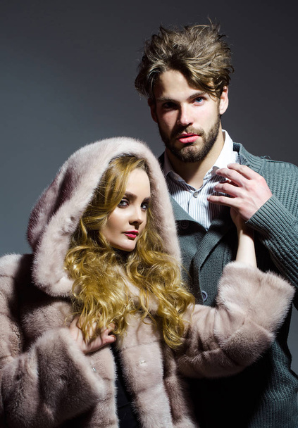 Boyfriend hold hand of girlfriend in mink fur coat - Photo, Image
