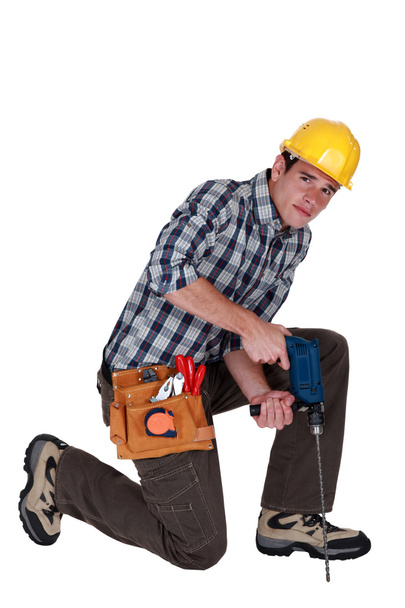 Man drilling into the floor - Foto, immagini
