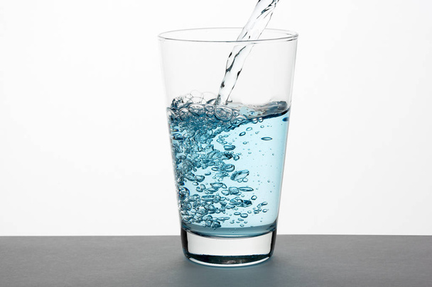 blue water in a glass - Photo, Image