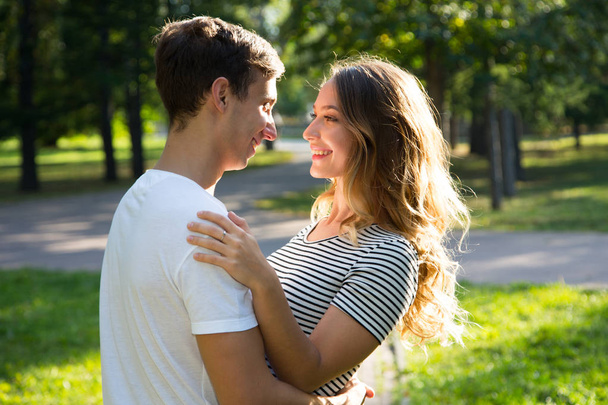 couple hugging in a park in sunny day - Foto, imagen