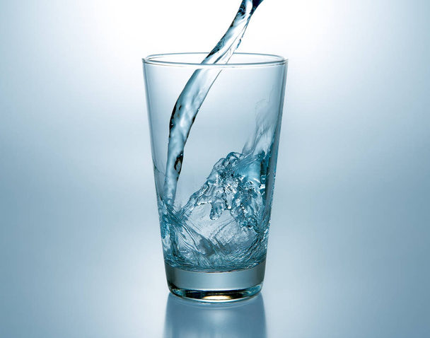  blue water in a glass - Фото, изображение