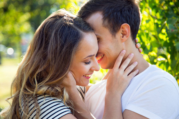 couple hugging in a park in sunny day - Foto, Imagen