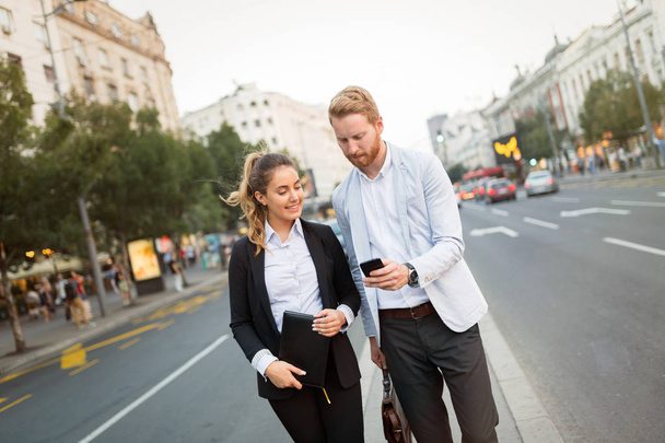 Businesspeople commuting and walking in city - Фото, зображення