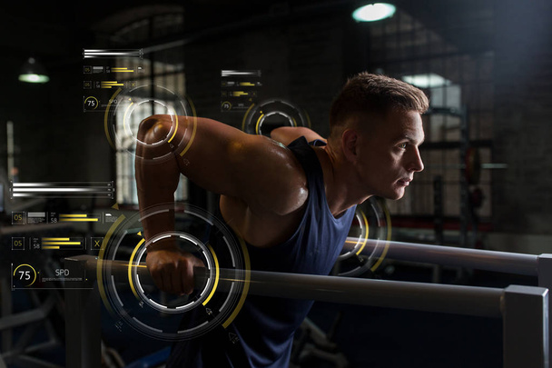 man doing triceps dip on parallel bars in gym - Фото, зображення