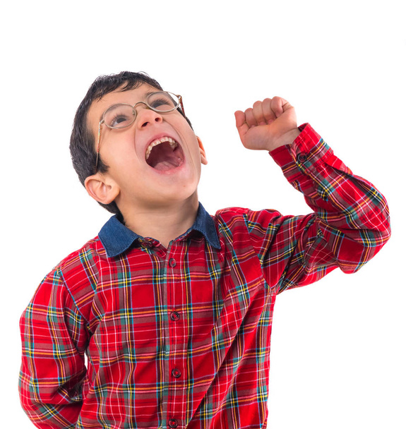 little boy in glasses expresses his joy with his fist - Foto, imagen