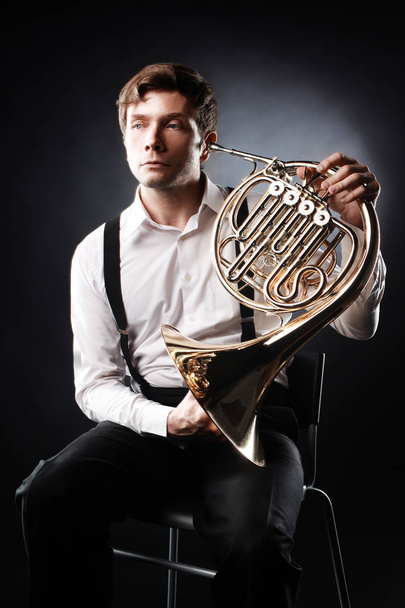 French horn player. Classical musician portrait - Zdjęcie, obraz