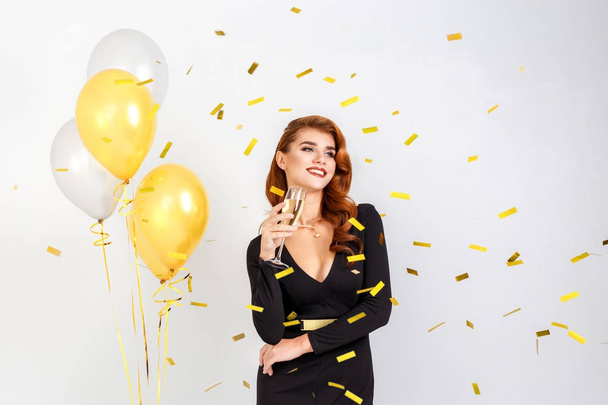 Portrait of Happy Beautiful elegant woman with golden balloons c - Foto, imagen