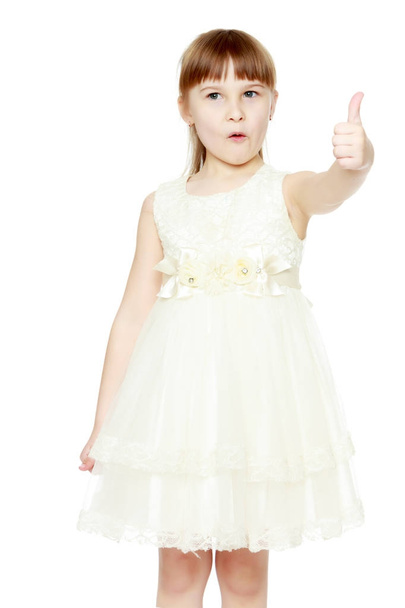 Little girl holding her thumb up - Zdjęcie, obraz