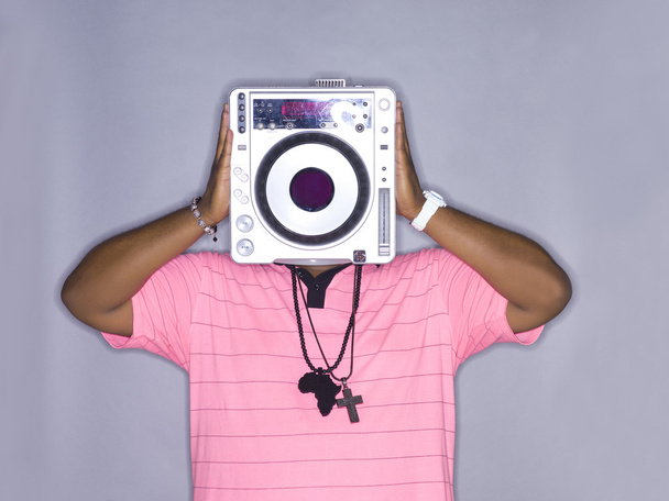 man holding a dj machine - Fotó, kép