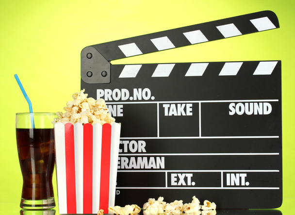 Movie clapperboard, cola and popcorn on background - Fotoğraf, Görsel