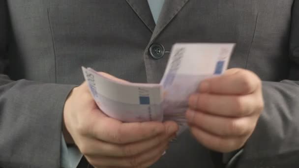 Unfair deputy manager putting bribe in his jacket pocket, corruption and crime - Footage, Video