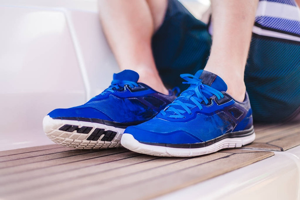 male legs in  blue sneakers - Photo, Image