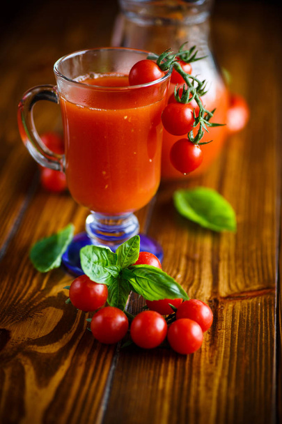 Homemade natural tomato juice in a decanter - 写真・画像