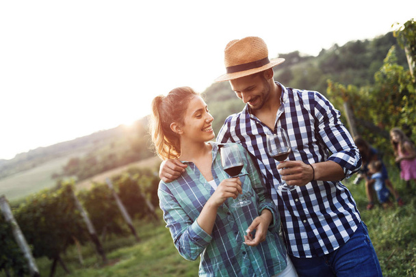 Happy couple in vineyard before harvesting - Foto, Imagen