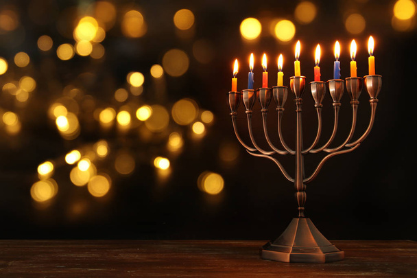 jewish holiday Hanukkah background with menorah (traditional candelabra) and burning candles - Fotografie, Obrázek