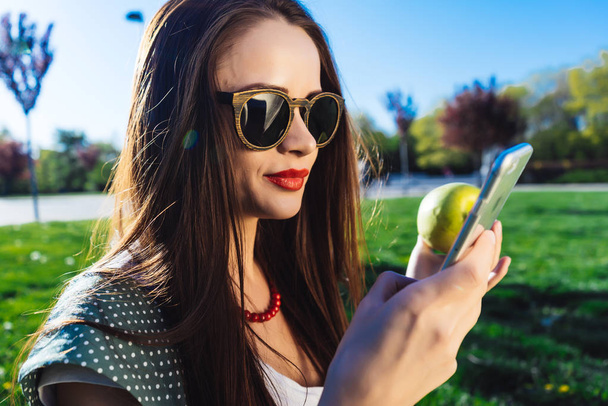 Woman use app in smartphone,looking something,healthy teeth - Φωτογραφία, εικόνα