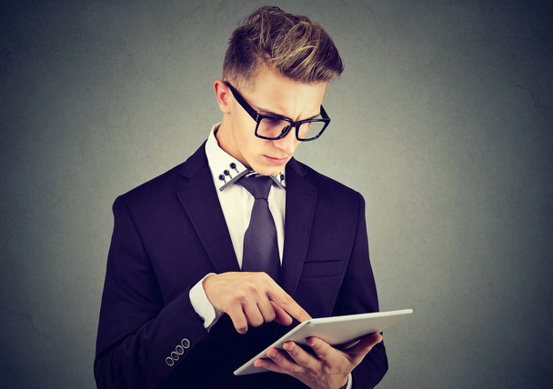 Young professional man using a tablet pc - Fotoğraf, Görsel