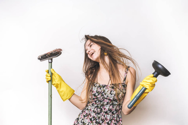 Emotional happy cleaning woman with mop and plunger - 写真・画像