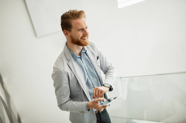 confident businessman using tablet - Fotó, kép