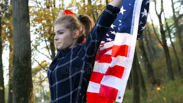 Patriotic Proud Beautiful young woman with American USA stars and stripes flag. freedom and memorial concept - Video