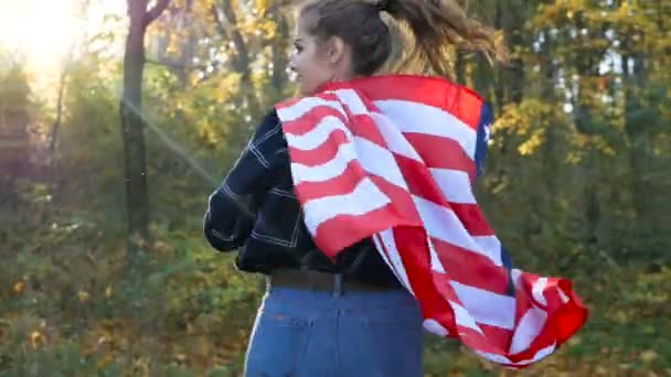 Patriotic Proud Beautiful young woman with American USA stars and stripes flag. freedom and memorial concept - Záběry, video