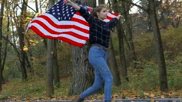 Patriotic Proud Beautiful young woman with American USA stars and stripes flag. freedom and memorial concept - Metraje, vídeo