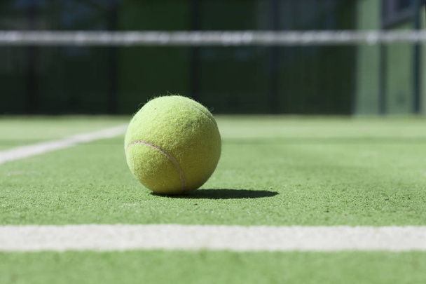 Tennis court with a close up ftom a tennisball - Foto, afbeelding