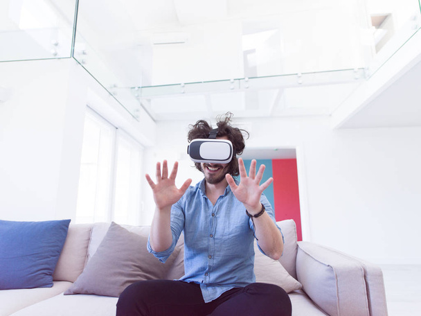 man getting experience using VR  - Foto, Bild