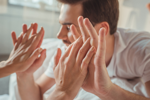 man touching hands of girlfriend - Fotografie, Obrázek