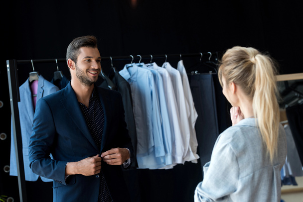 couple choosing suit in boutique - Foto, Imagem