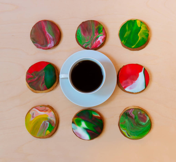 Cup of coffee and homemade cookies decorated with fondant  - Photo, image