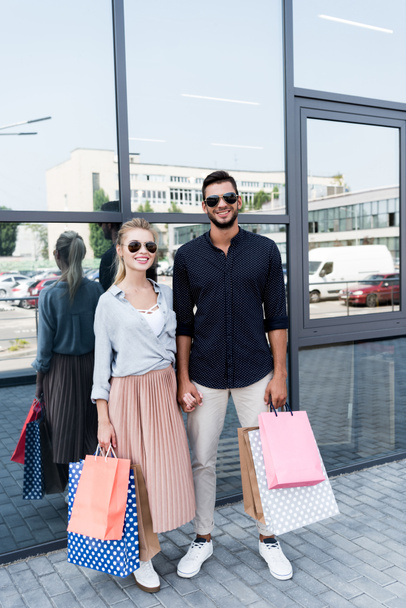 young couple with shopping bags - Foto, Imagem