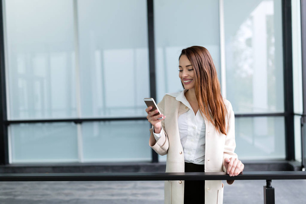  businesswoman texting on cellphone - Photo, image