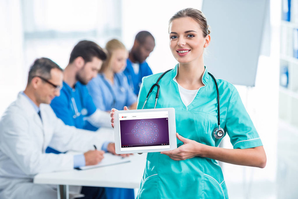 young nurse holding tablet - Photo, Image