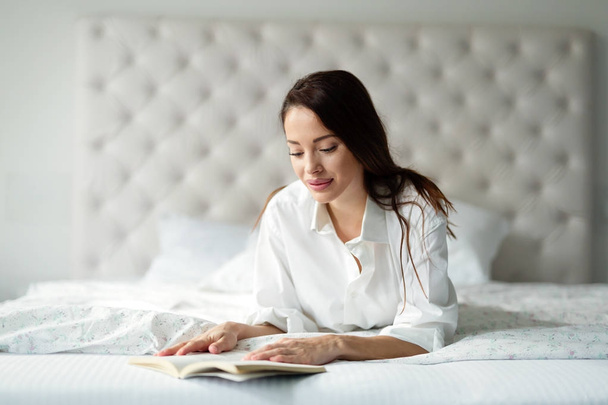 Young woman  reading book - Фото, зображення