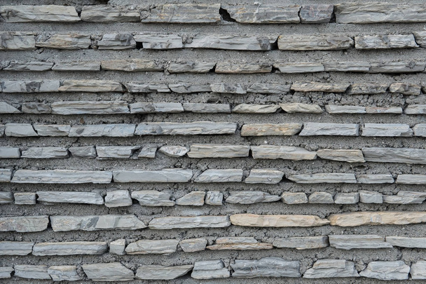 Ladrillos planos con textura de cemento, superficie de piedra
 - Foto, Imagen
