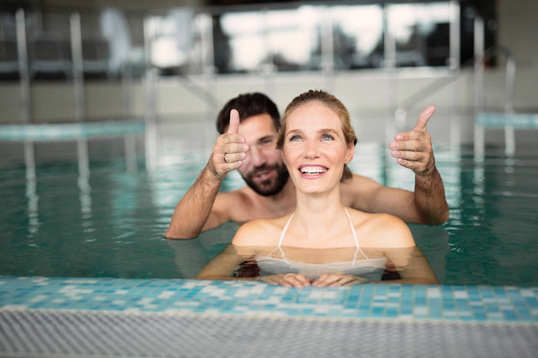  couple relaxing in swimming pool - Photo, Image