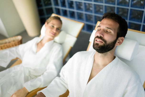  man and beautiful woman relaxing in spa - Фото, изображение